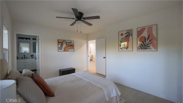 bedroom with ceiling fan and connected bathroom