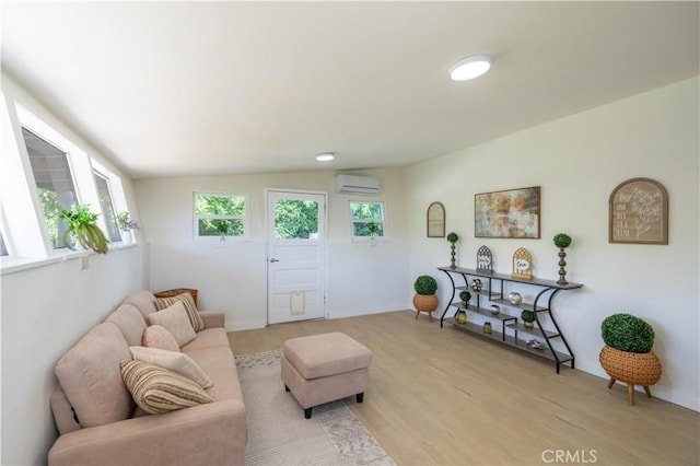 35414 Date Ave, Yucaipa, CA 92399 - living area with light wood finished floors and a wall mounted air conditioner