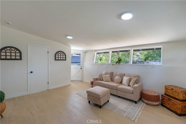 35414 Date Ave, Yucaipa, CA 92399 - living room featuring light wood finished floors, plenty of natural light, and vaulted ceiling