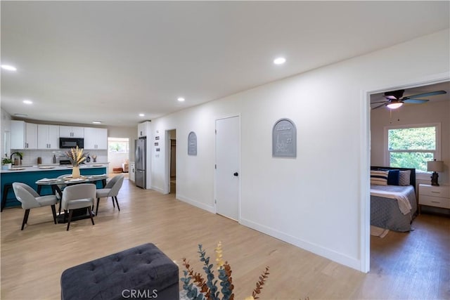 35414 Date Ave, Yucaipa, CA 92399 - living room with healthy amount of natural light, light wood-style flooring, recessed lighting, and ceiling fan