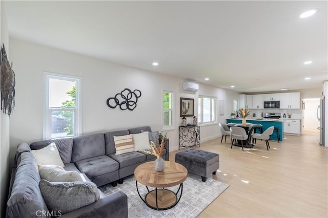 35414 Date Ave, Yucaipa, CA 92399 - living area with light wood-style flooring, recessed lighting, and an AC wall unit