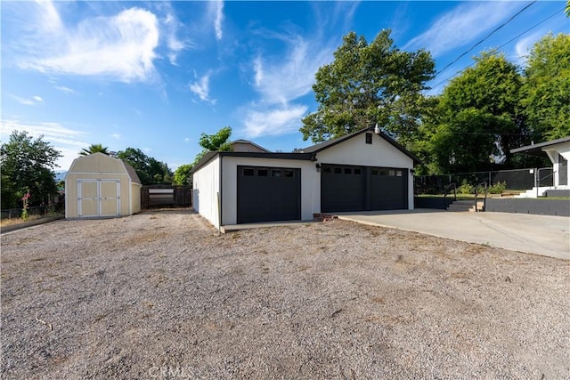35414 Date Ave, Yucaipa, CA 92399 - garage featuring a storage shed and driveway