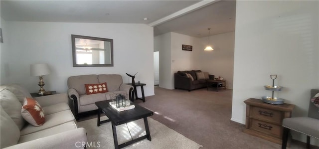 living room with light colored carpet and vaulted ceiling