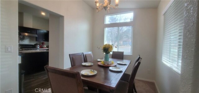 dining area featuring a notable chandelier