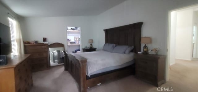 bedroom featuring light carpet