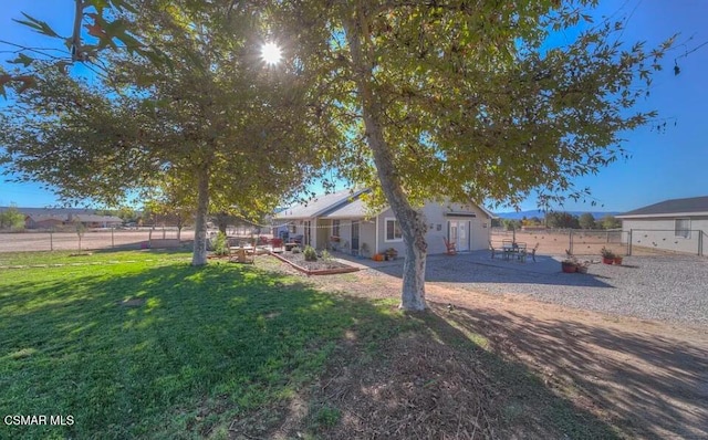 view of yard with a patio and a rural view