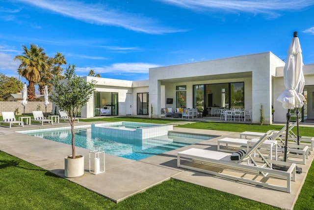 view of swimming pool with a patio area and an in ground hot tub