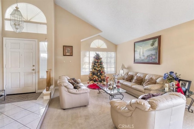 tiled living room with high vaulted ceiling