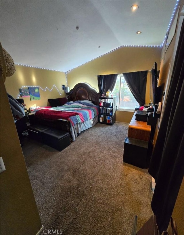 bedroom with carpet and vaulted ceiling