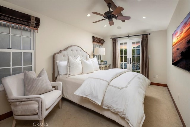 carpeted bedroom with access to exterior, french doors, and ceiling fan