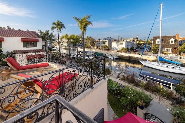 balcony featuring a water view