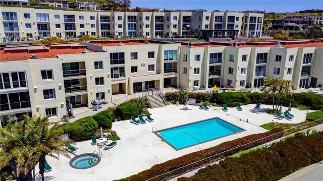 view of pool featuring a patio area and a hot tub