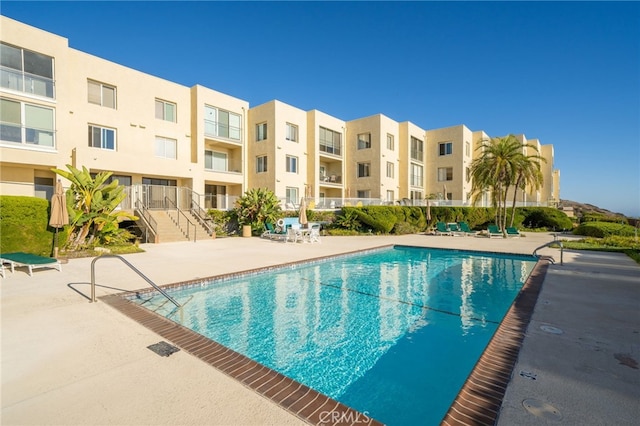 view of swimming pool featuring a patio