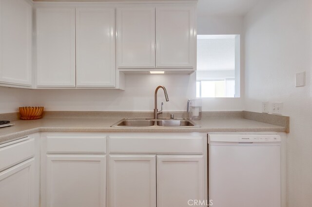 kitchen featuring white cabinetry, sink, and white dishwasher