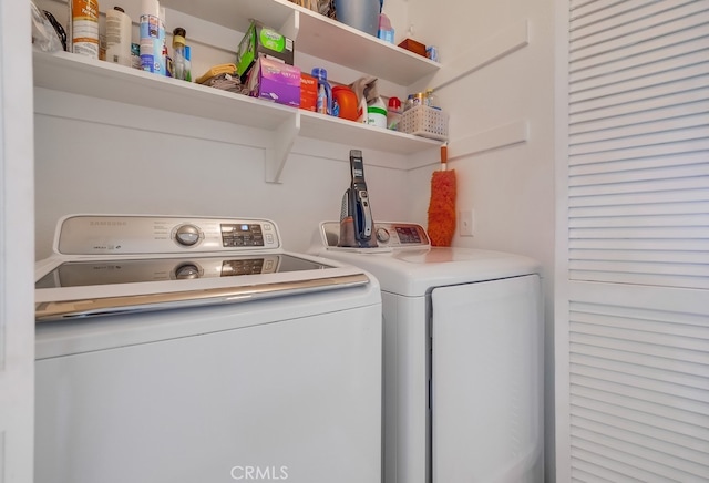 laundry area with washing machine and clothes dryer