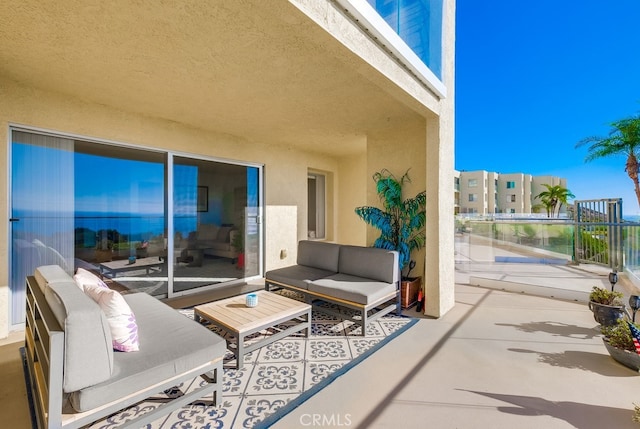 view of patio with a balcony and an outdoor hangout area