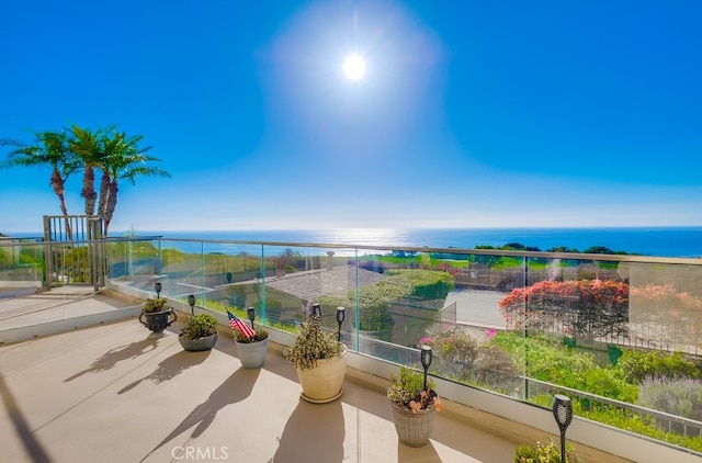 balcony featuring a water view