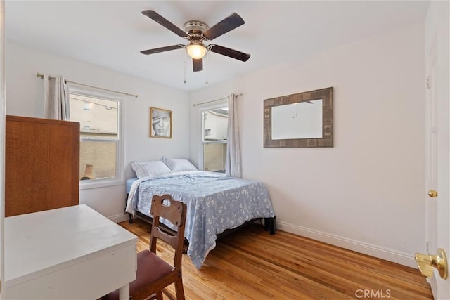 bedroom featuring wood-type flooring and ceiling fan