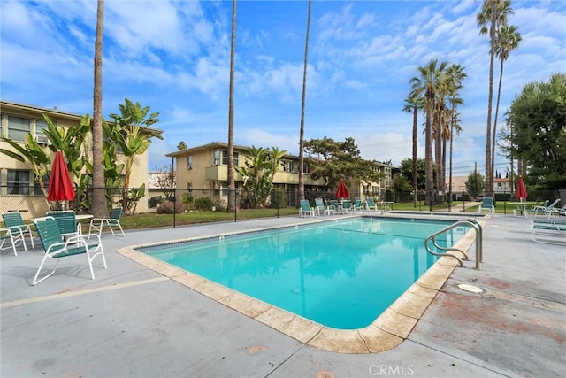 view of swimming pool with a patio