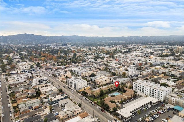 birds eye view of property featuring a mountain view