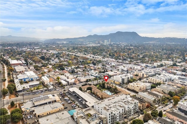 birds eye view of property featuring a mountain view