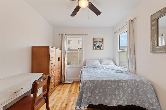 bedroom featuring ceiling fan and light hardwood / wood-style floors