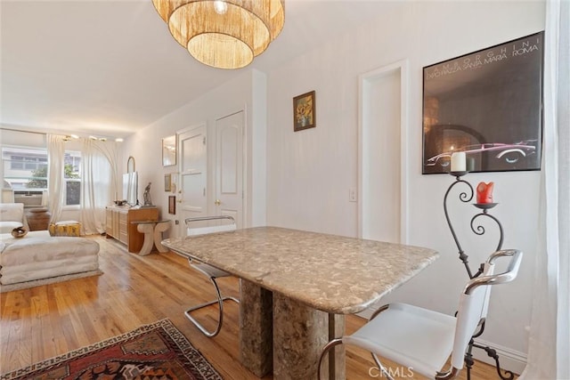 dining room with light hardwood / wood-style flooring