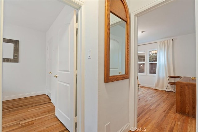 corridor featuring light hardwood / wood-style floors