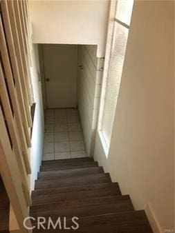 staircase with tile patterned flooring