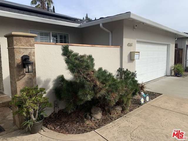 view of side of property featuring a garage