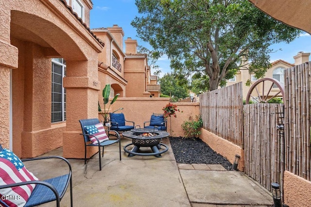 view of patio / terrace with a fire pit