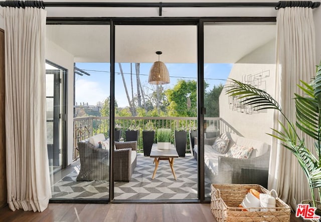 doorway to outside with hardwood / wood-style flooring