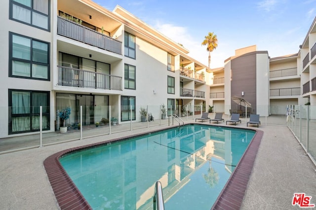 view of swimming pool featuring a patio