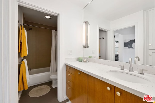 full bathroom with tile patterned flooring, vanity, toilet, and shower / bath combo with shower curtain