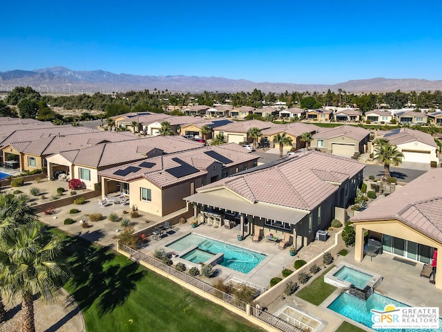 bird's eye view with a mountain view