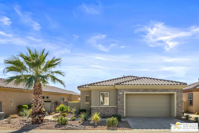 mediterranean / spanish-style home with a garage