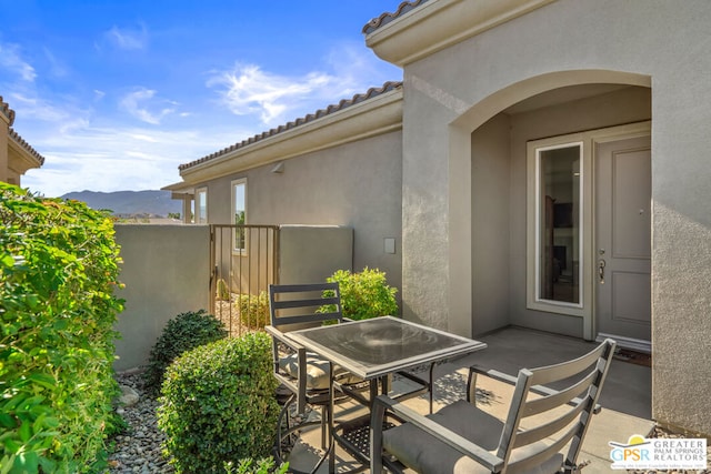 view of patio / terrace with a mountain view