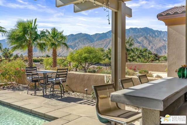 view of patio / terrace with a mountain view