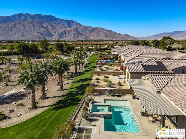 birds eye view of property featuring a mountain view