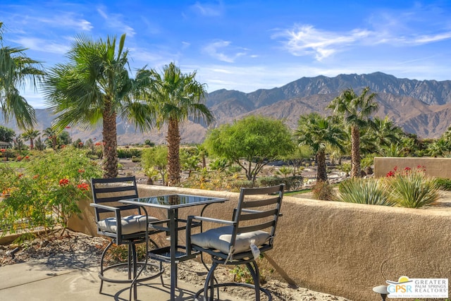 view of patio / terrace featuring a mountain view