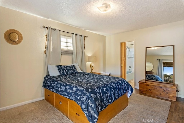 12755 Blue Heron Ct, Clearlake Oaks, CA 95423 - bedroom featuring a textured ceiling, dark hardwood / wood-style flooring, and ensuite bathroom