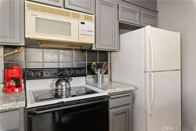 12755 Blue Heron Ct, Clearlake Oaks, CA 95423 - kitchen featuring tasteful backsplash, gray cabinets, and white appliances