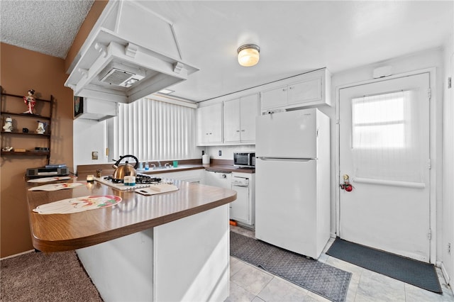 kitchen featuring custom exhaust hood, white cabinetry, white appliances, and kitchen peninsula