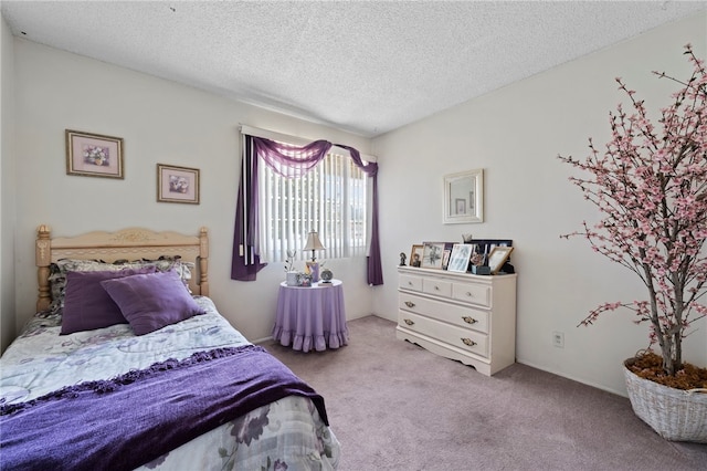 carpeted bedroom featuring a textured ceiling