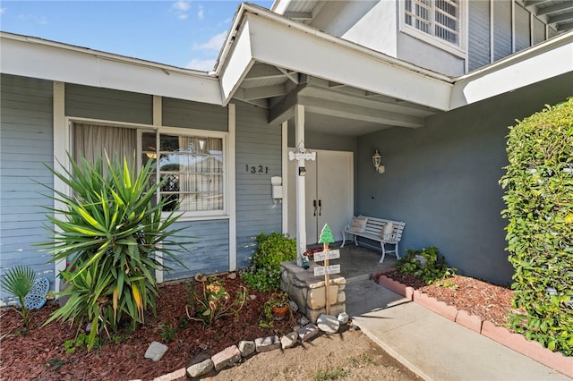 doorway to property featuring a porch