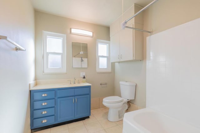 full bathroom featuring shower / bathing tub combination, vanity, toilet, and a wealth of natural light