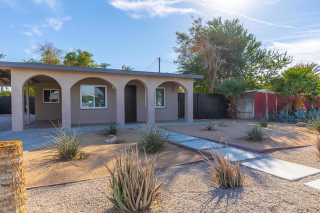 ranch-style home featuring a patio