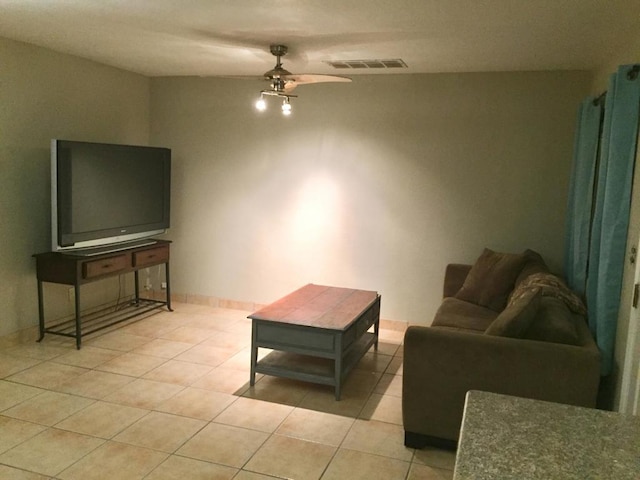 living room with tile patterned floors and ceiling fan