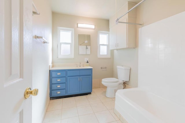 full bathroom featuring shower / washtub combination, tile patterned flooring, vanity, and toilet