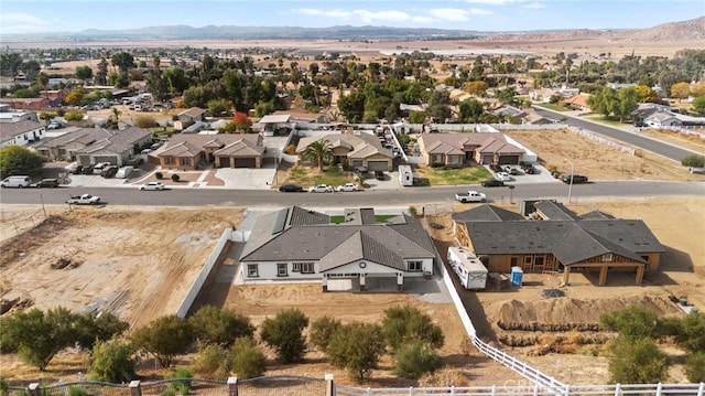 birds eye view of property with a mountain view